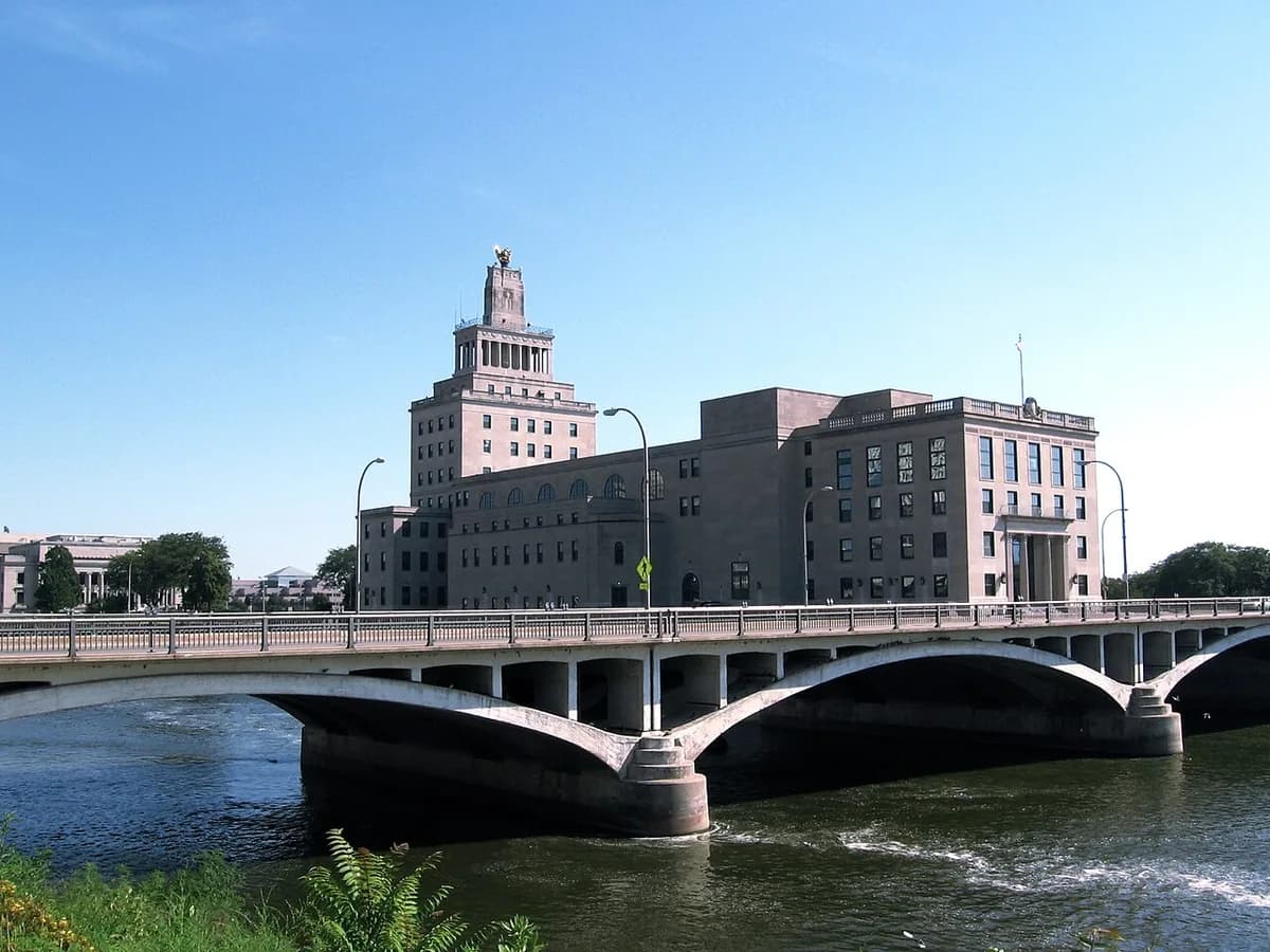 Mays Island bridge over river with downtown buildings in Cedar Rapids, Iowa