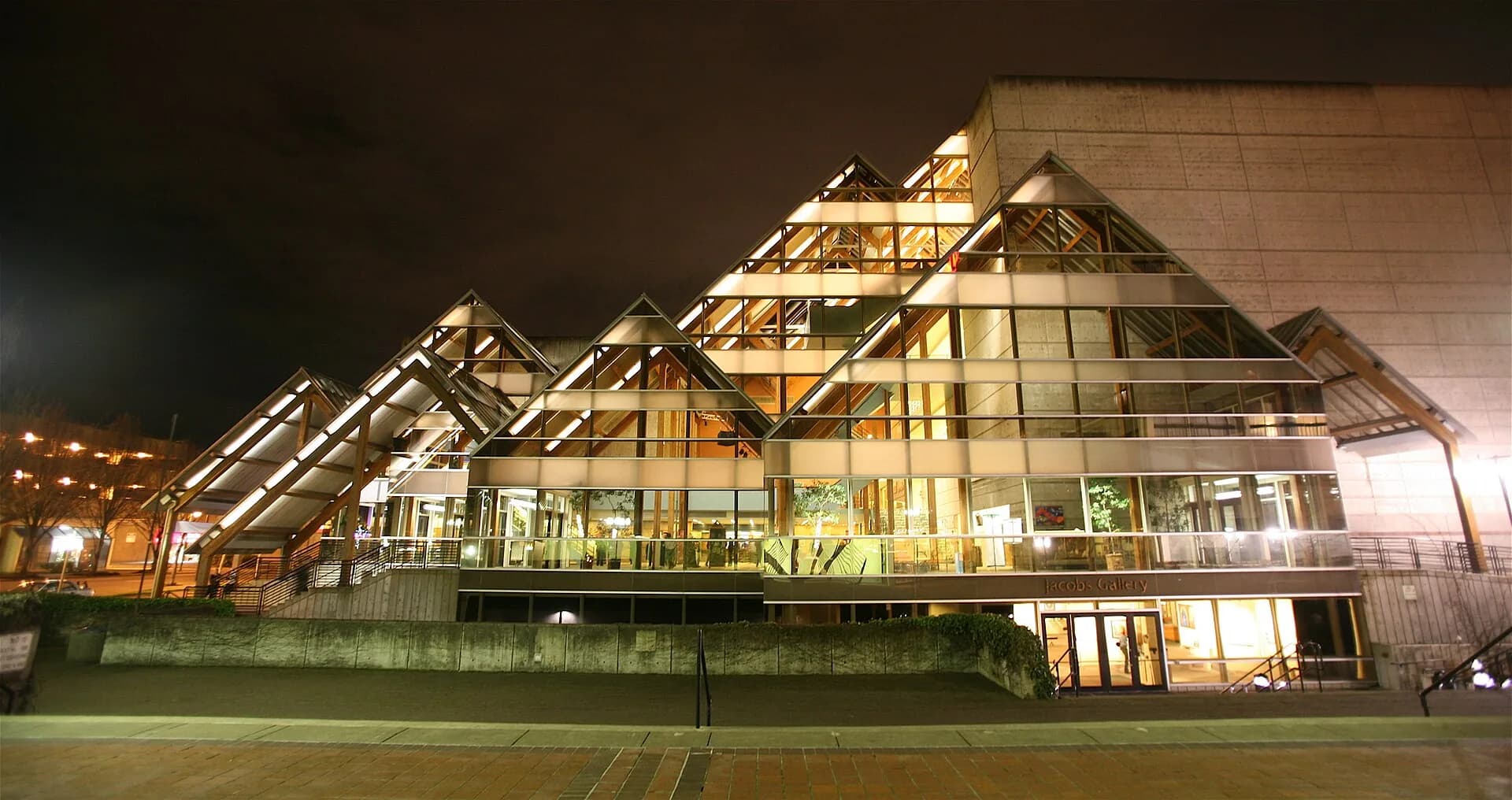 Hult Center for the Performing Arts lit at night, wide frame in Eugene, Oregon