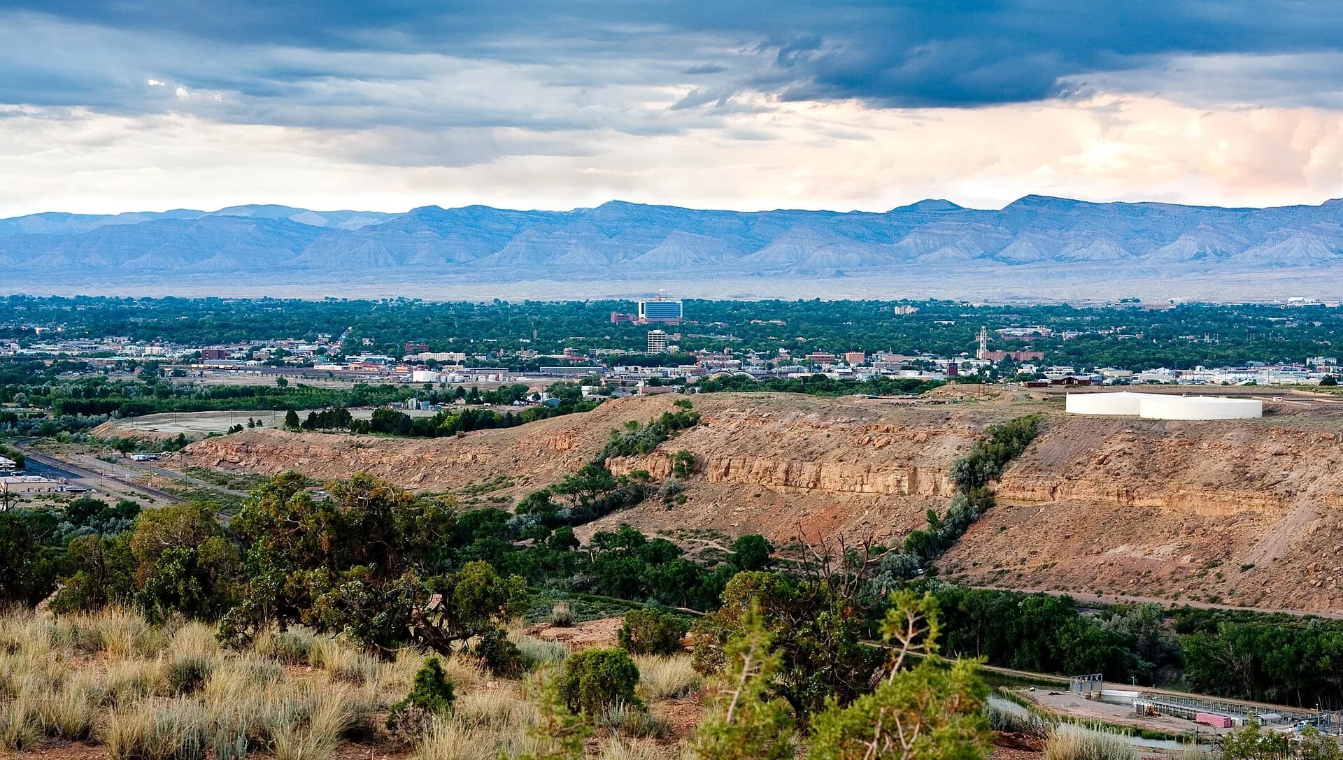 Wide valley view of city with Book Cliffs in Grand Junction, Colorado