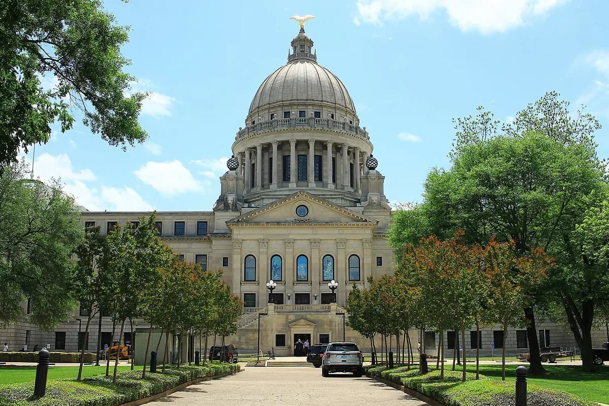 Mississippi State Capitol framed by trees in Jackson, Mississippi