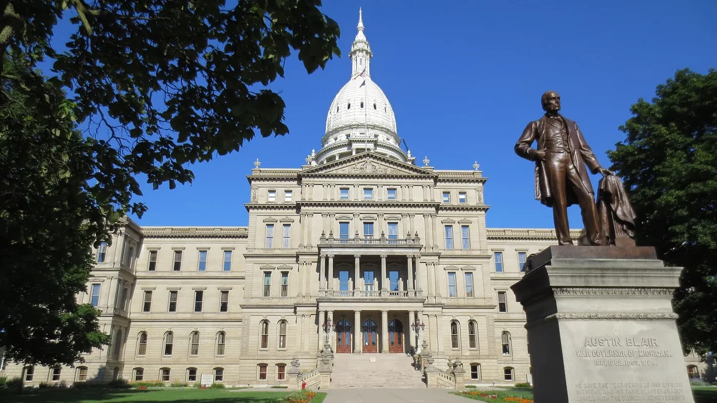 Michigan State Capitol with statue in Lansing, Michigan