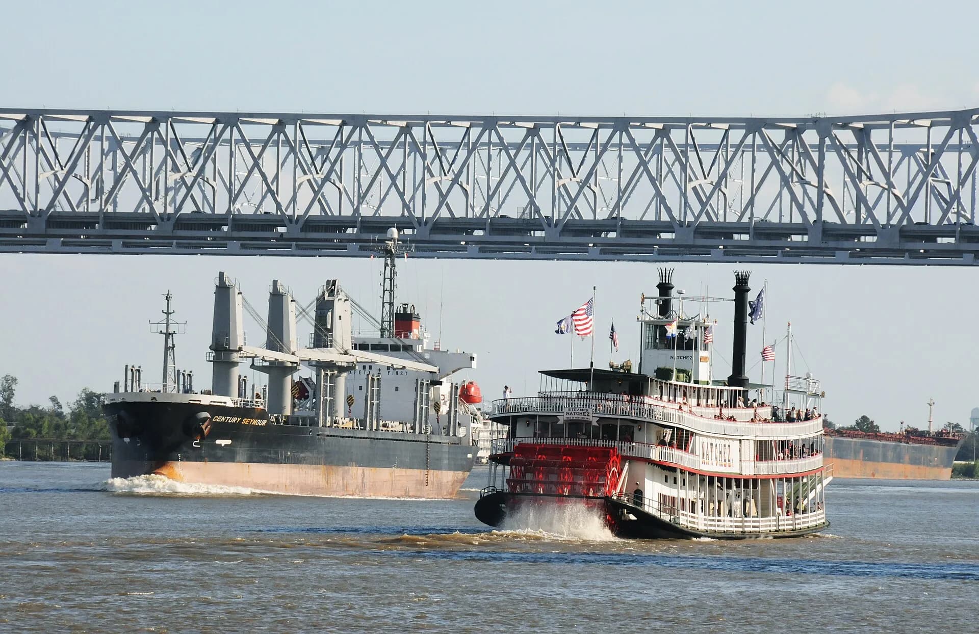 Steamboats on the Mississippi with the bridge in New Orleans, Louisiana
