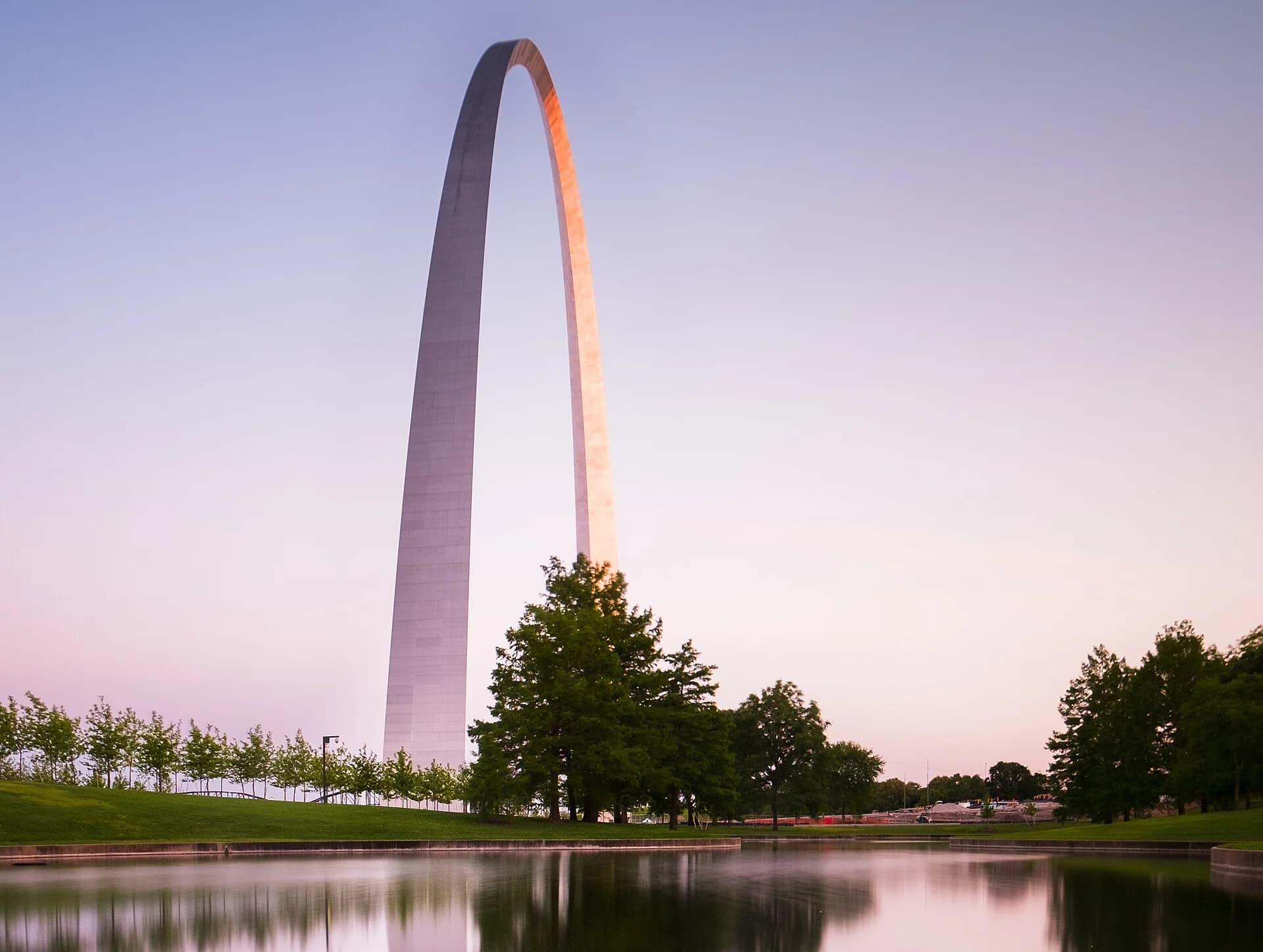 Gateway Arch at sunset reflected in pond in St. Louis, Missouri