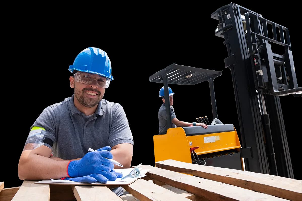 Man holding clipboard with arms resting on wood pallet and warehouse working driving forklift in background